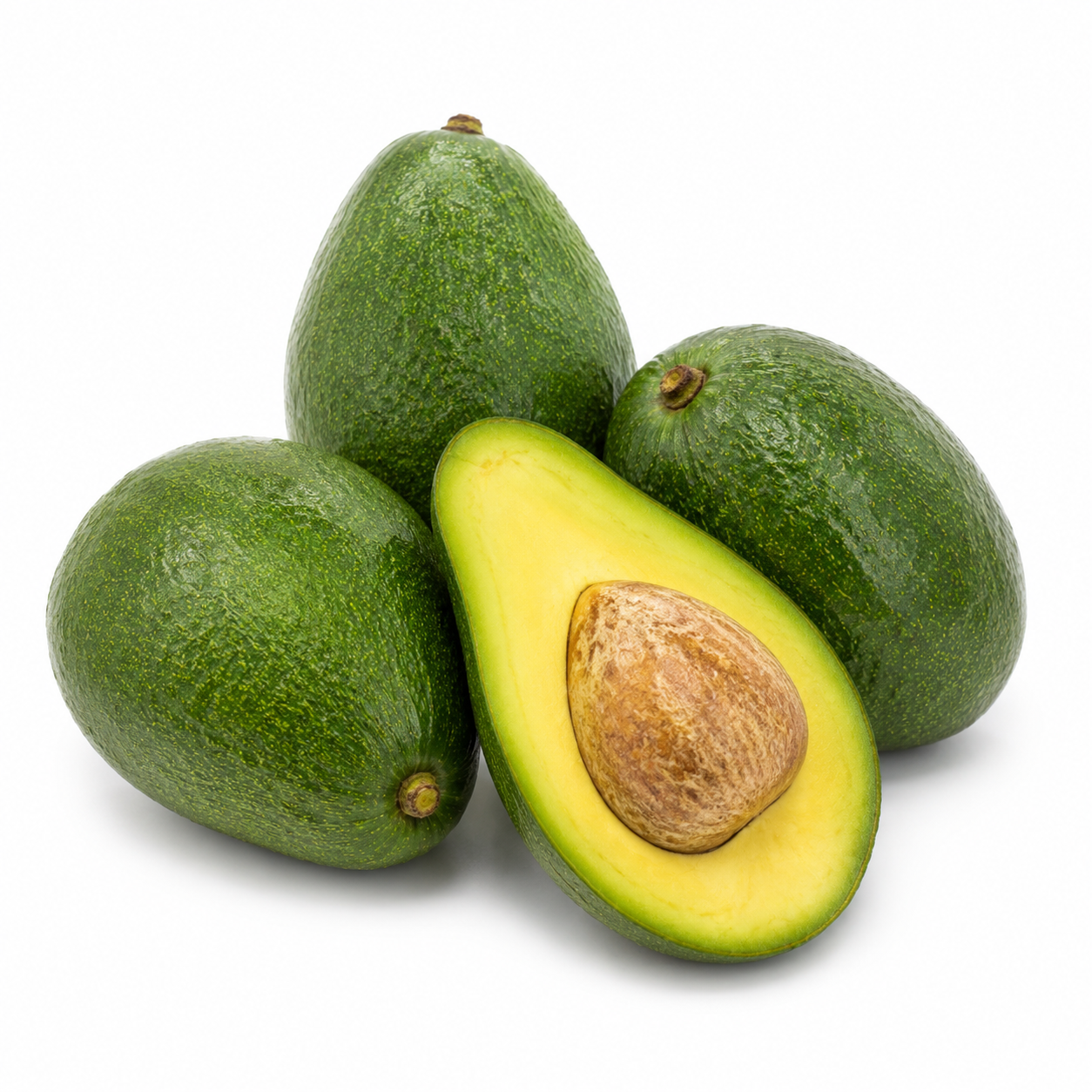 Whole green Holiday avocados with one halved fruit showing golden-yellow flesh and a medium tan seed.